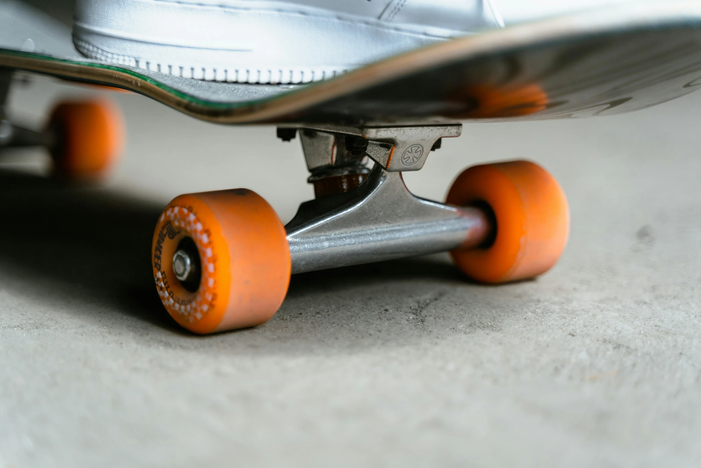 the wheel on this skateboard is orange