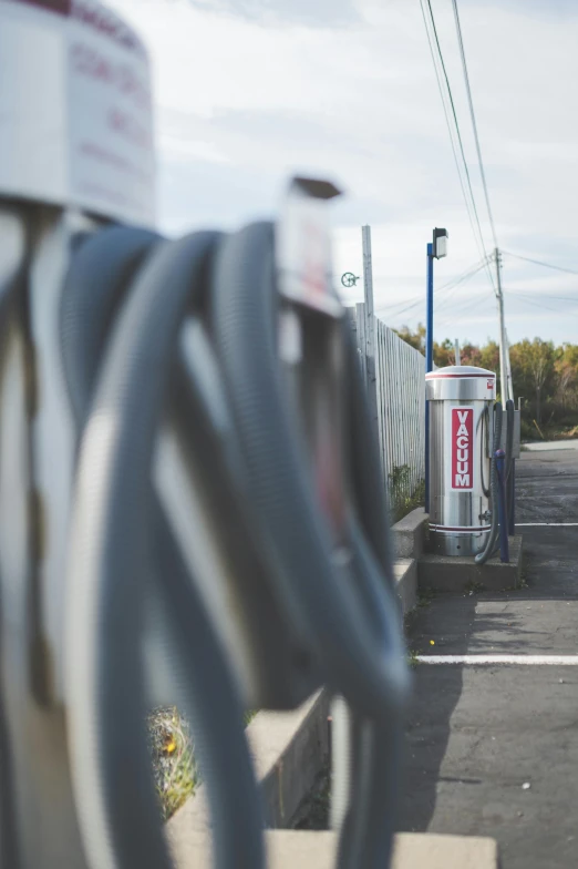 a group of silver hoses connected to some poles