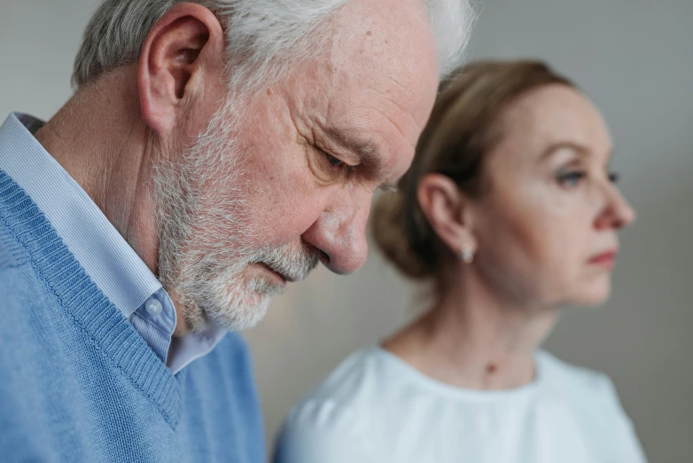 a man and woman are staring in opposite directions