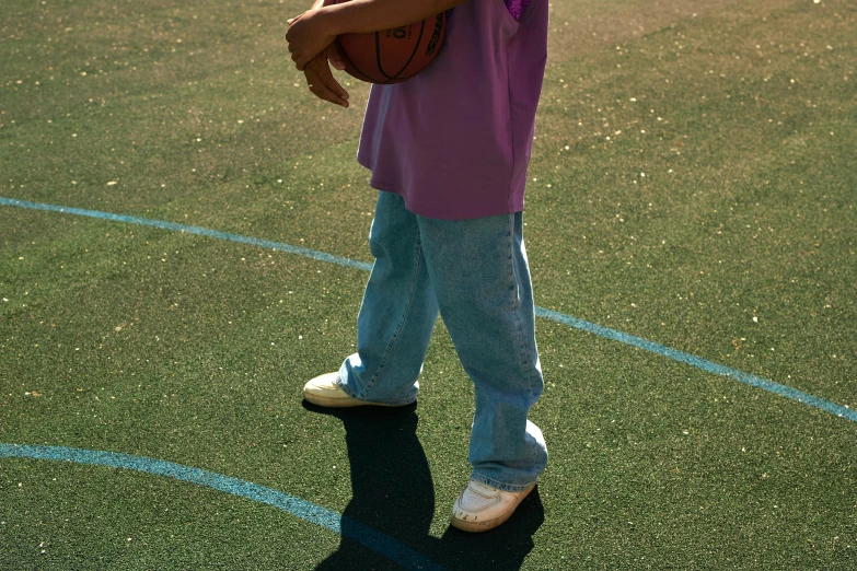 a  with a basketball on a court