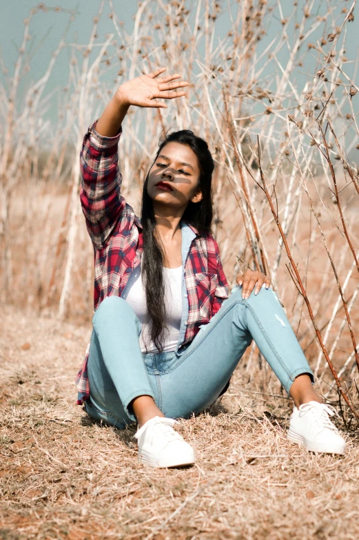 an image of a woman sitting on the ground