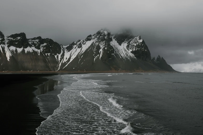 black and white po of mountains and the ocean