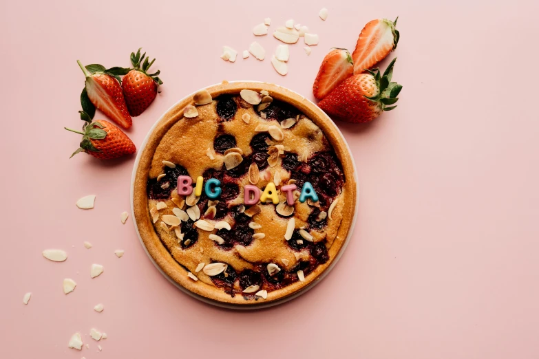 an up - close image of a baked dish with fruit and letters on it