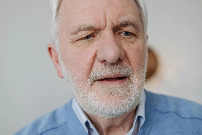 a man with white hair and a gray beard
