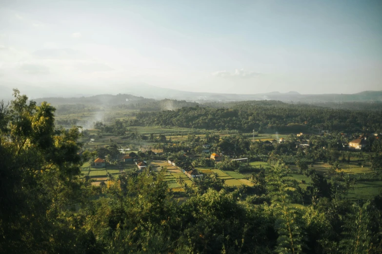 a scenic view of several hills and buildings