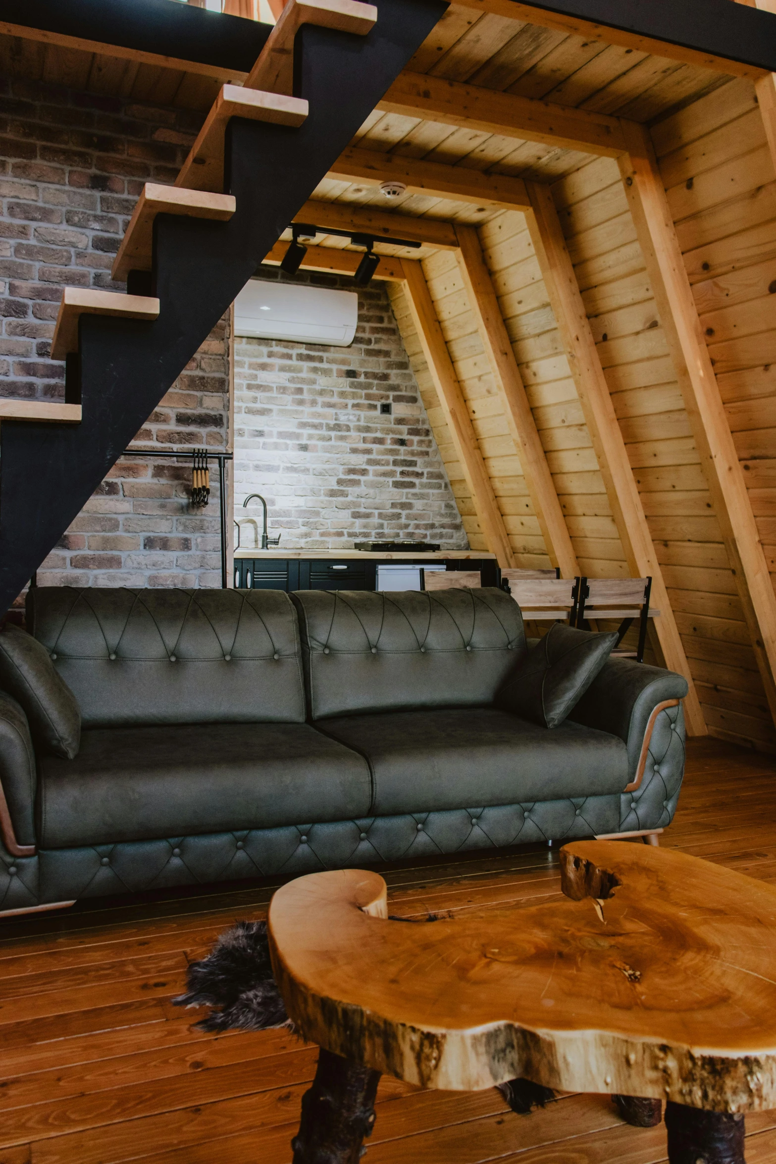 the inside of a house that has exposed ceilings