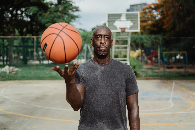 a man playing basketball on a basketball court