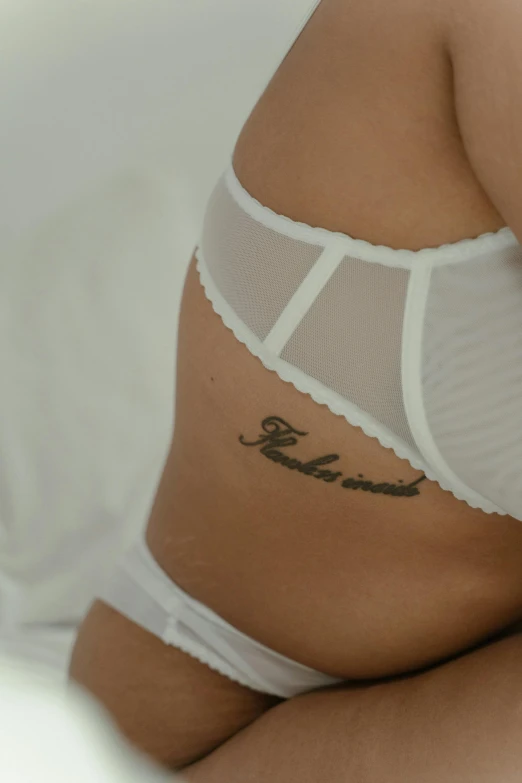 a woman wearing a white panties and revealing an open back