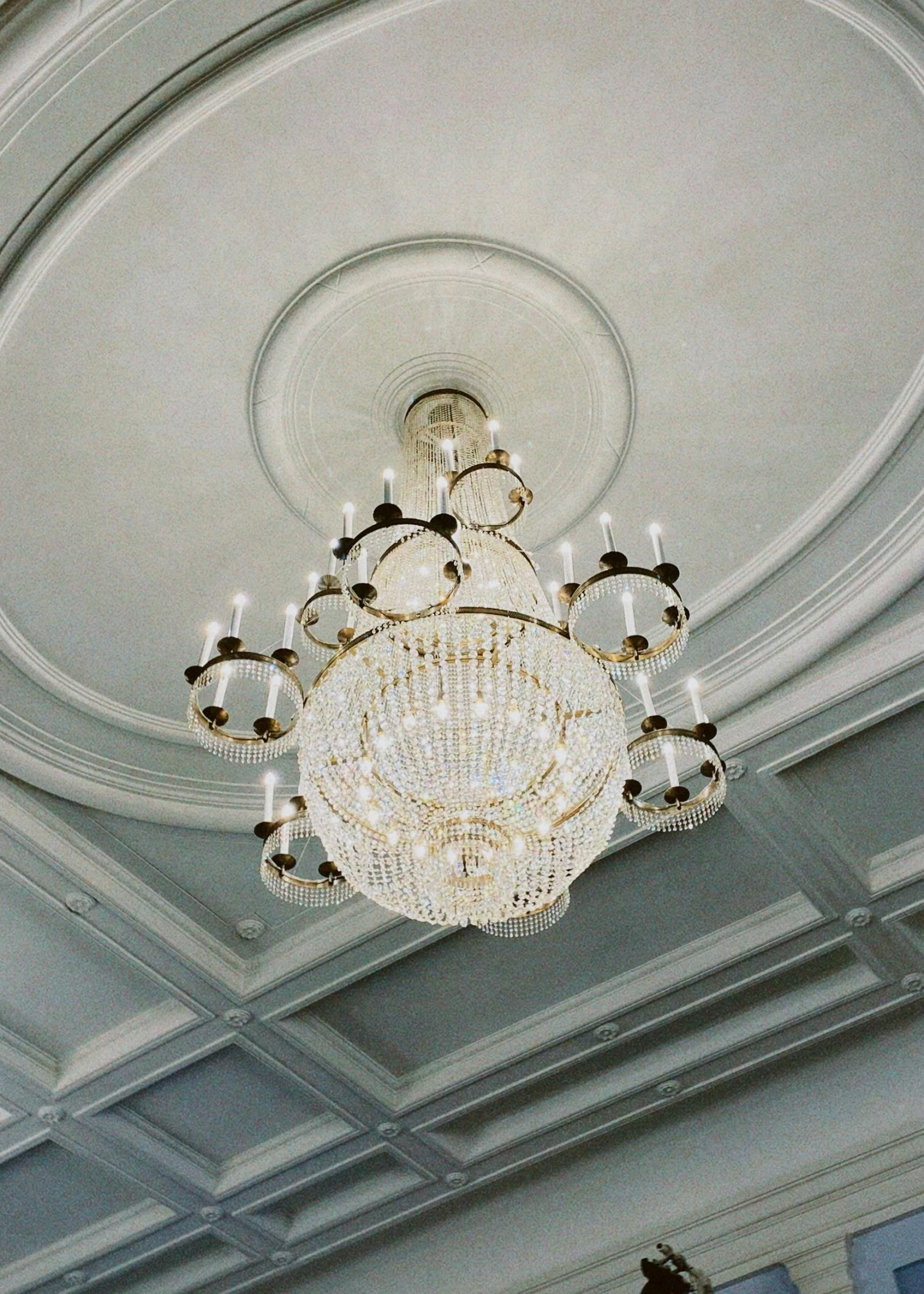 a chandelier that is suspended from a ceiling in a building