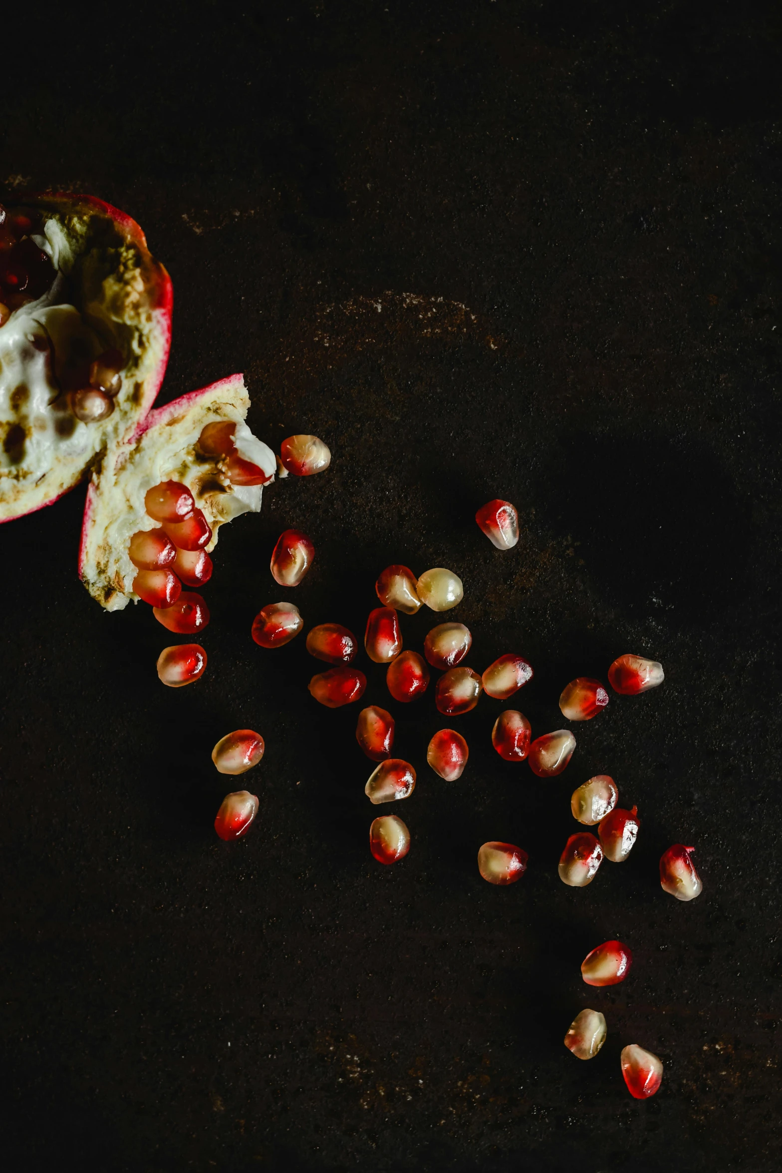 seeds and fruit that look very nice on black table