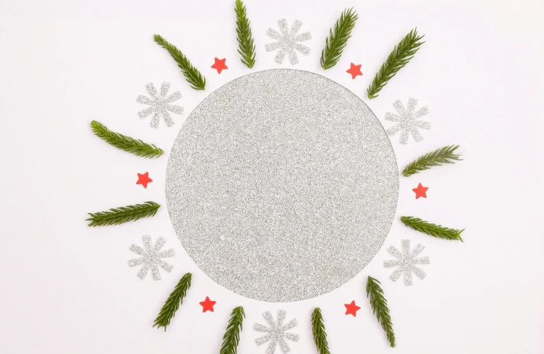 white background with green leaves and snowflakes