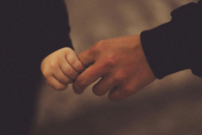 an image of two people holding hands