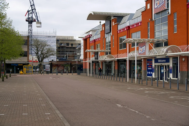 a empty street in front of a brick building