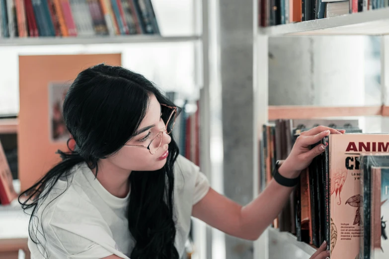 a girl with long hair holding up an old record