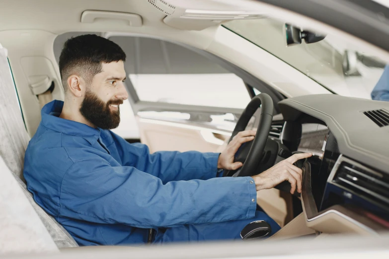 a man drives his car through the station