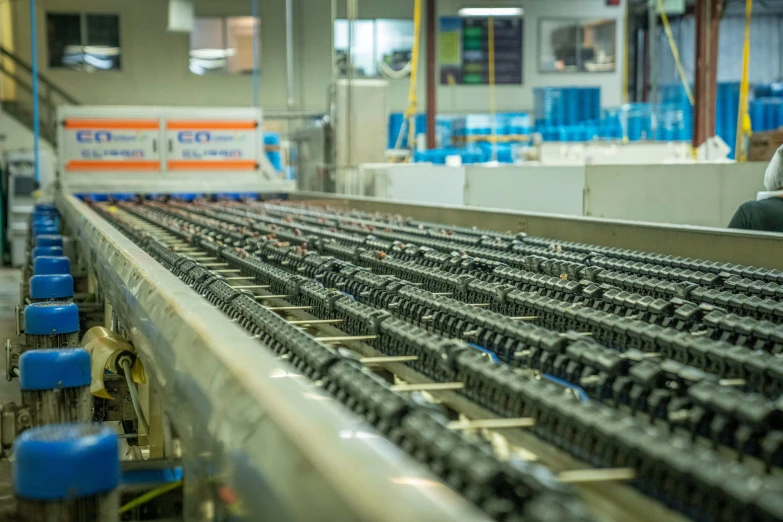 people are working at a factory with equipment