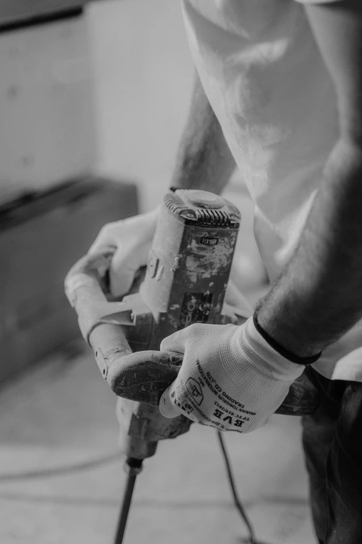 a person is holding two coffee cans in their hands