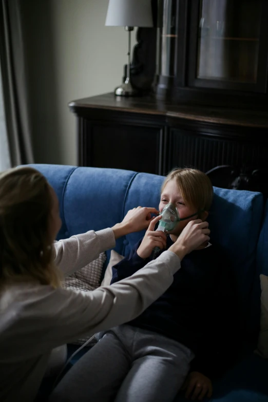 two woman putting soing in each other's mouth