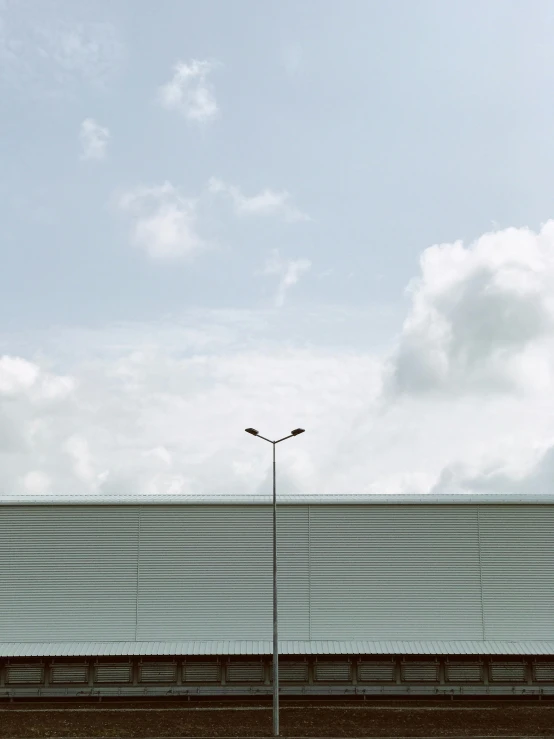 this is a view of a long fence at an empty field