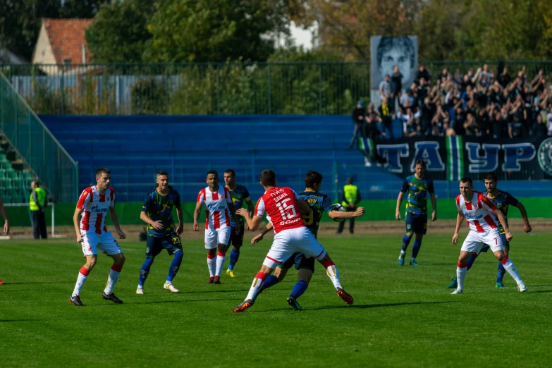 several soccer players are standing on a field