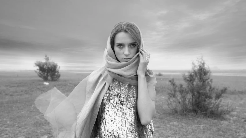 a black and white po of a woman with her head held up