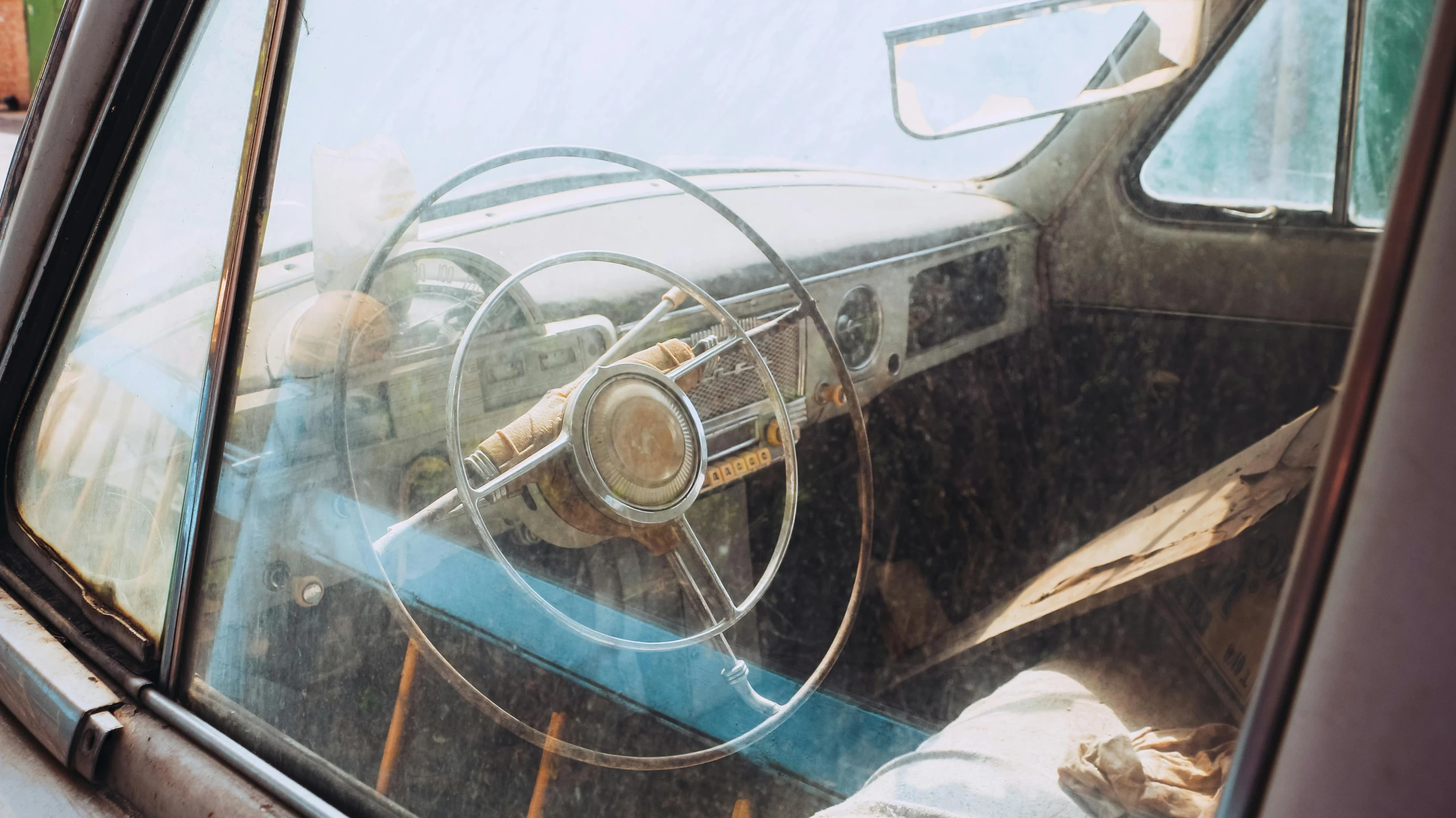 a car dashboard inside the cab of a vehicle with some wooden beams