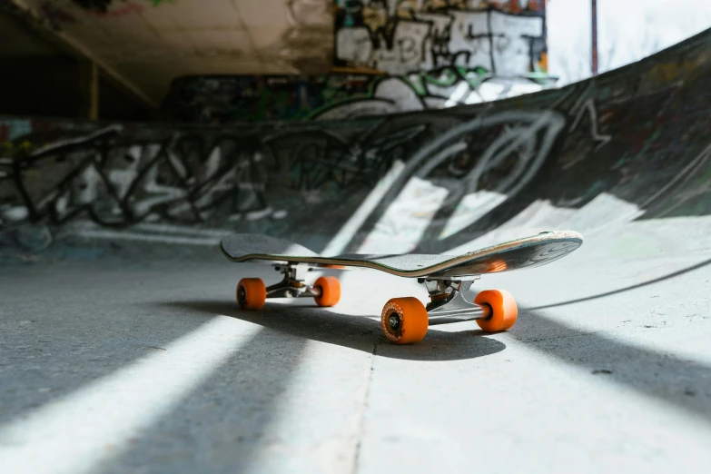 a skateboarders shadow and wall in a skate park