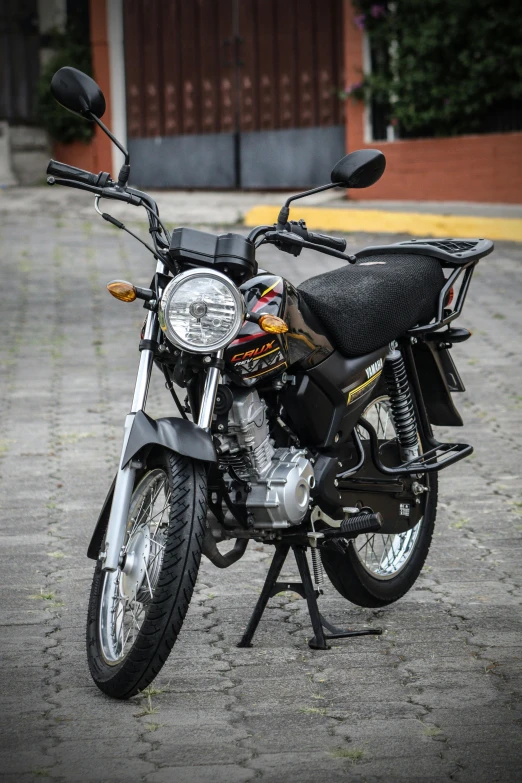 a motorcycle is shown parked on a gravel road