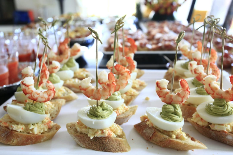 appetizers with food on them displayed on tray