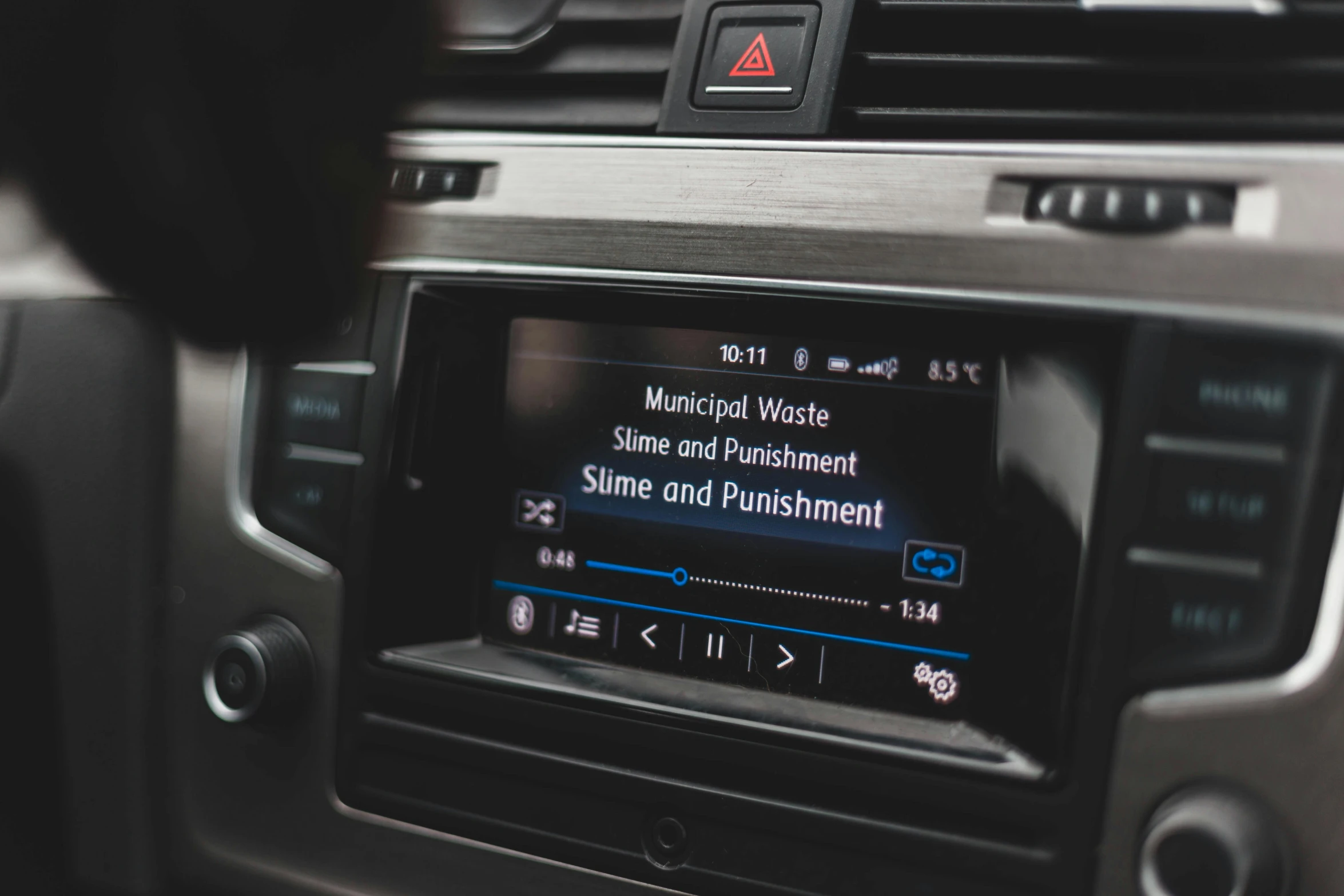 an image of a car radio with the screen showing a vehicle information feature