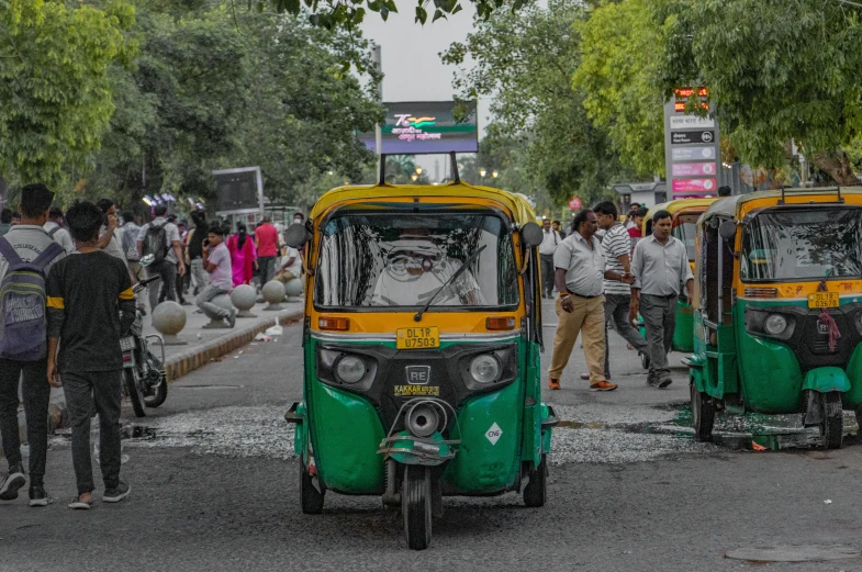 some green and yellow small cars and people