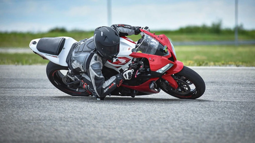 a man on a racing bike leans down