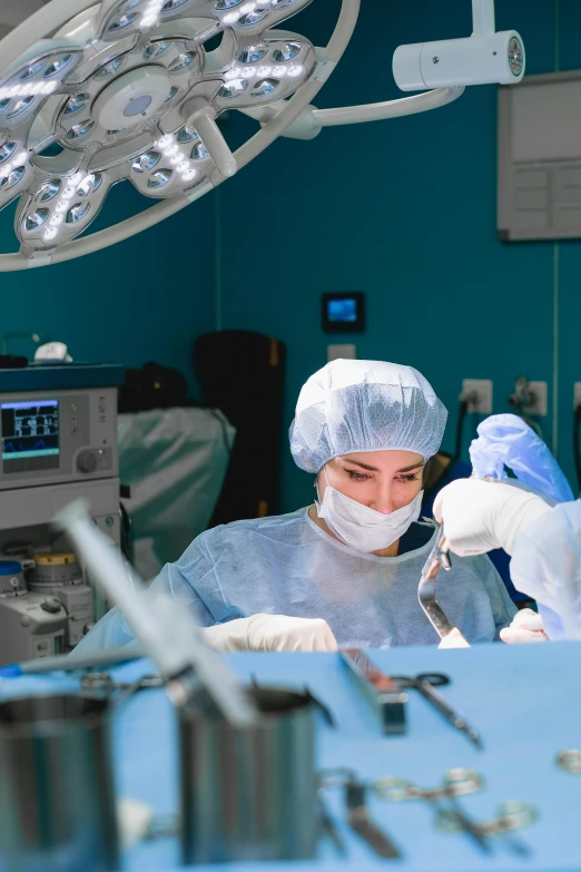 a person is preparing to  in an operating room