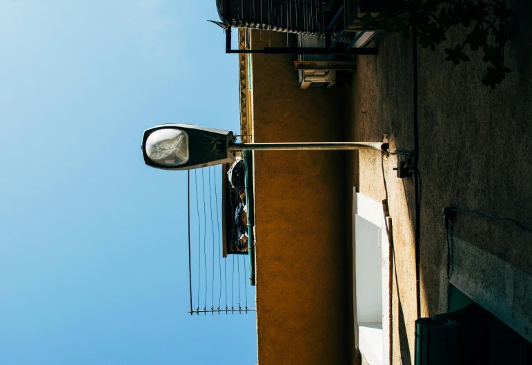 the side of a building with a street light