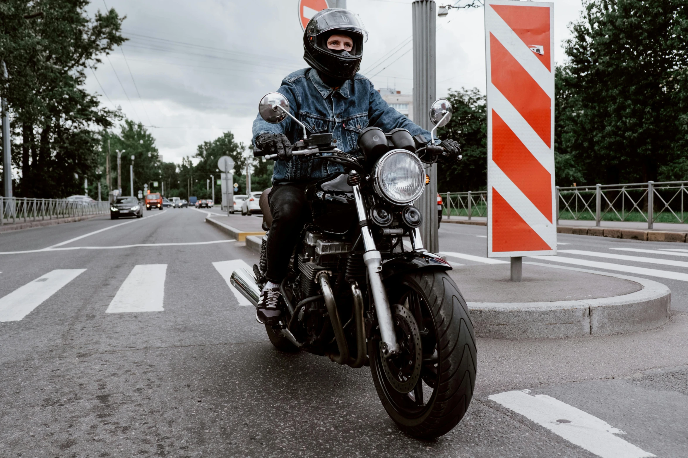 a man is riding his motorcycle on the street