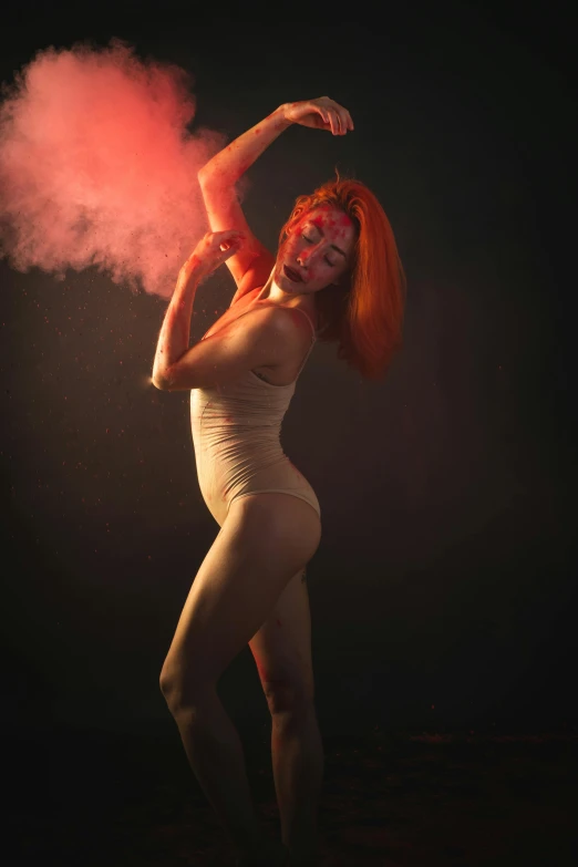 a woman with red hair in a bodysuit is doing a dance