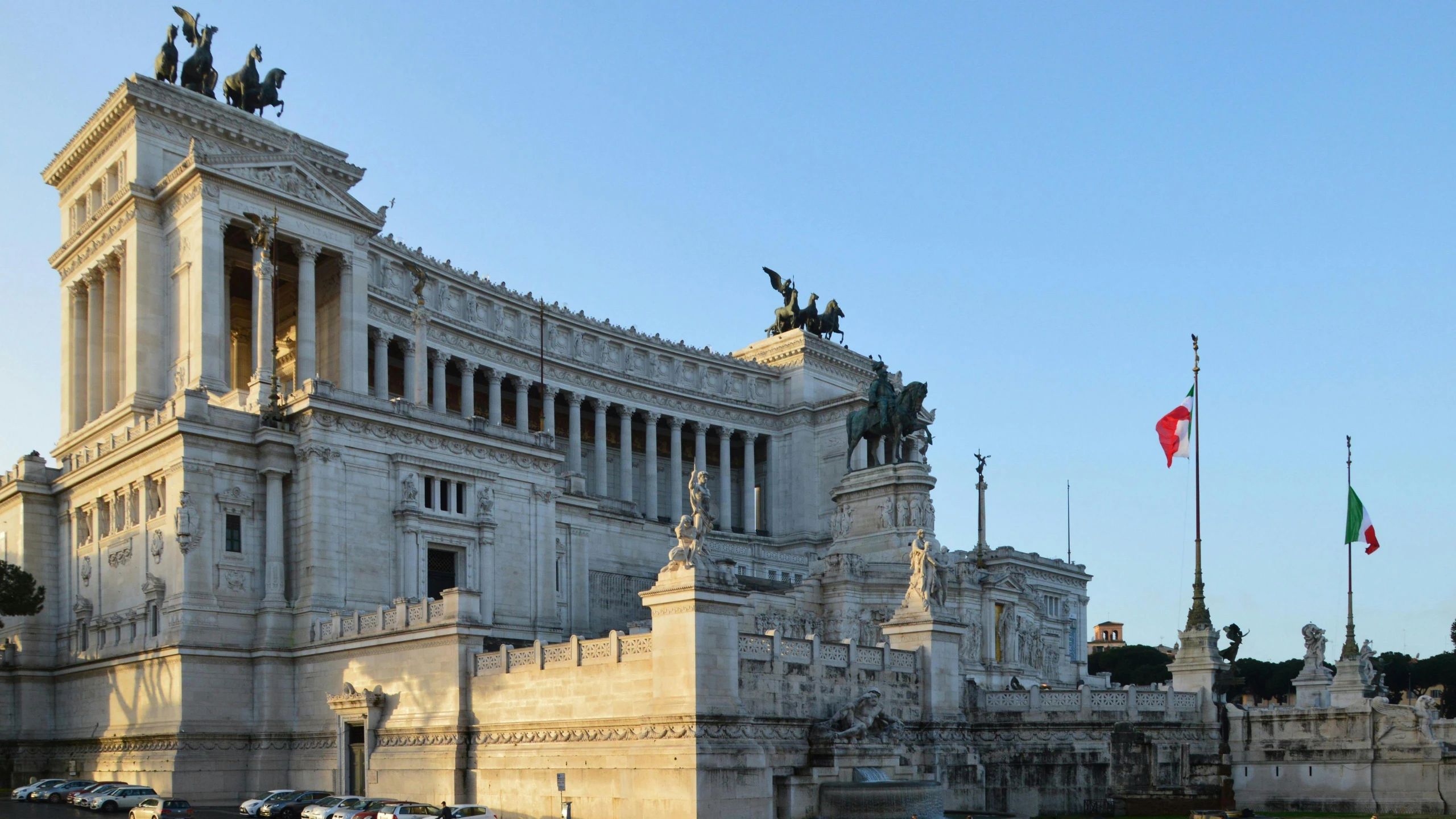 the building is made of stone with statues on it