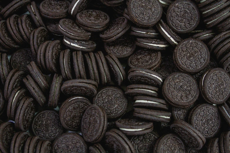 a pile of oreo cookies with chocolate chip on top