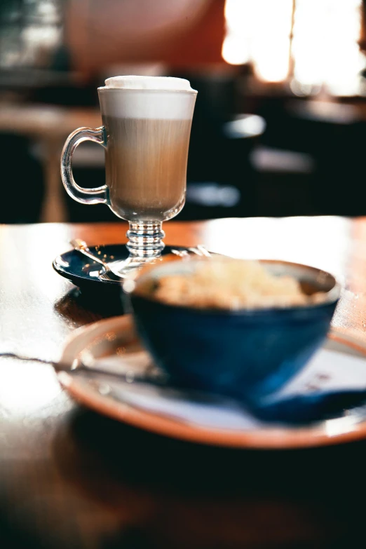 a table top with a cup and plate