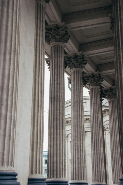 rows of old columns stand in a large room