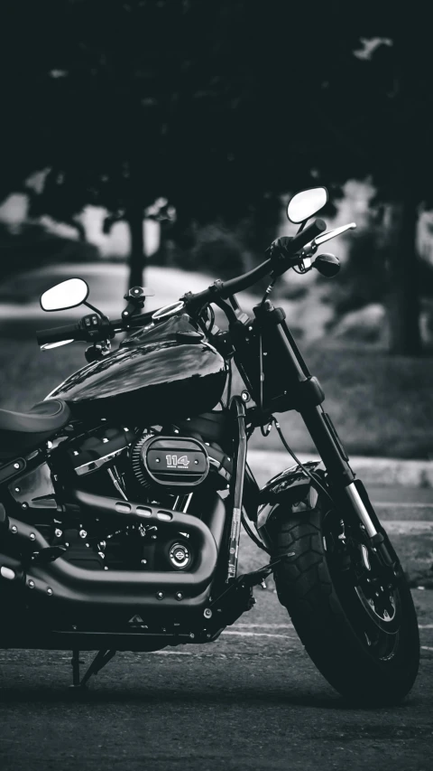 motorcycle with lights parked in front of some trees