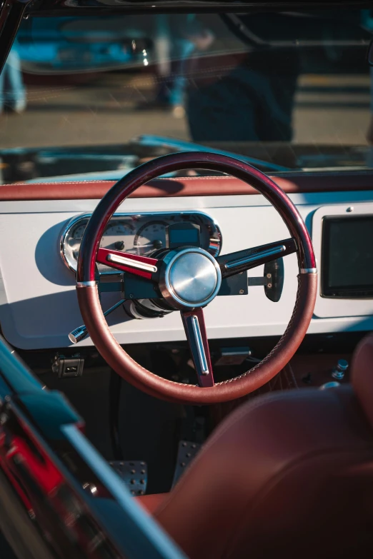 the dashboard of an old fashioned car with wood trim