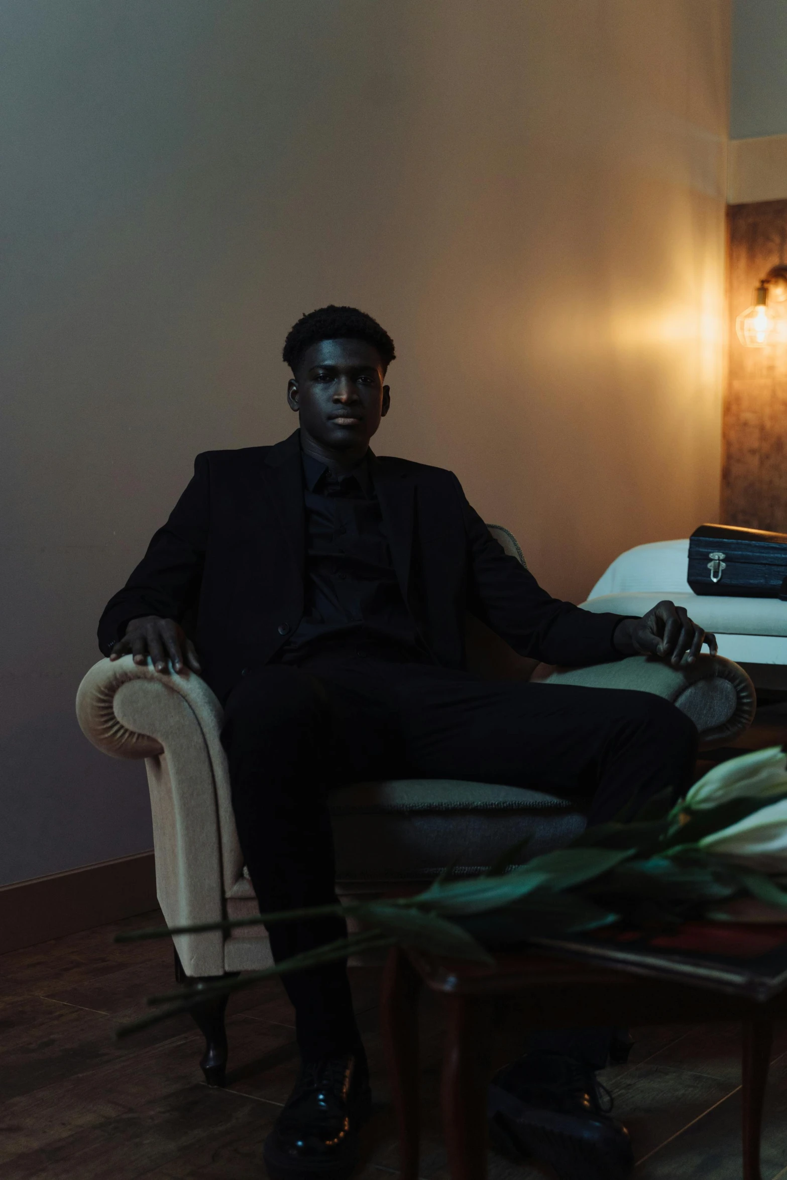 a man sitting in a chair in his living room