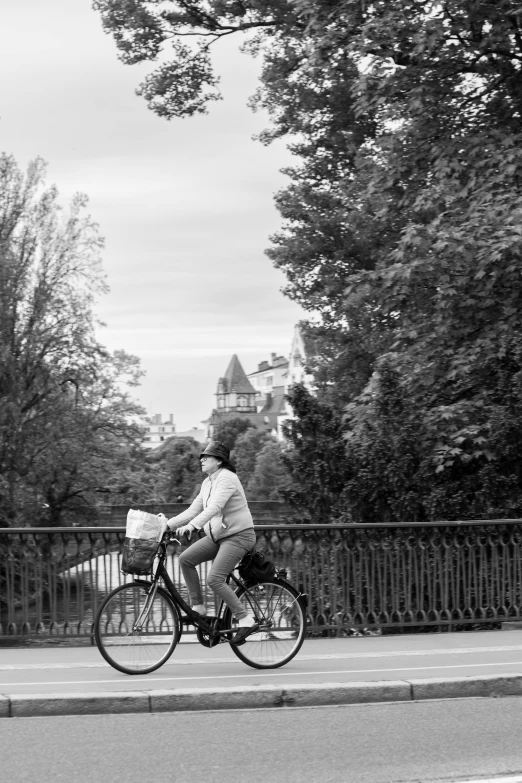 the man is riding his bike down the street