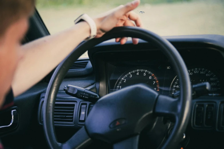 an image of a woman driving her car