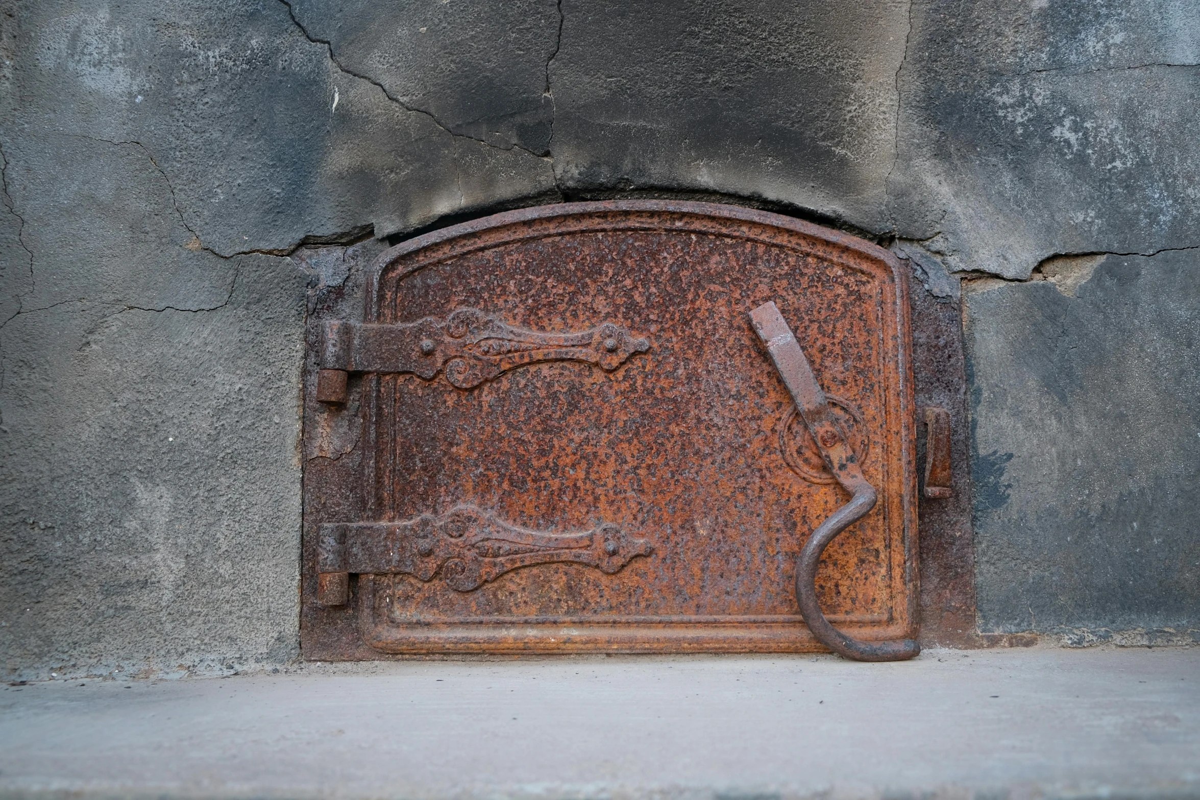 rusty metal door with the door handle open