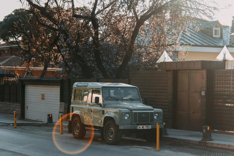 a grey land rover vehicle parked at an open parking space