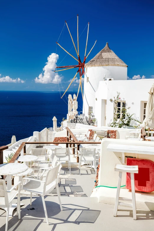 the white table has an iron windmill on it