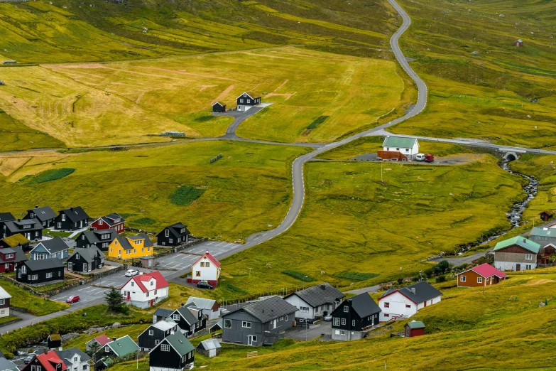 a view of a rural town with colorful houses