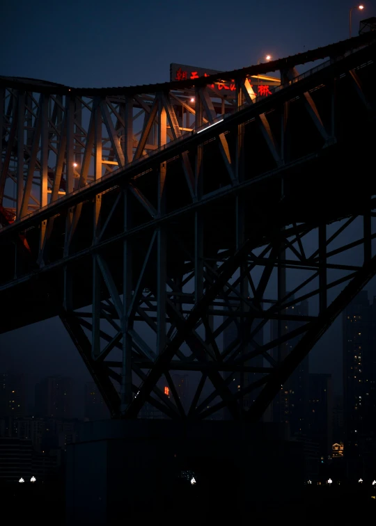 an elevated bridge with lights shining on it